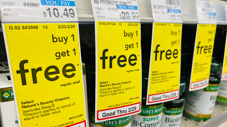 buy one get one free signs on shelf