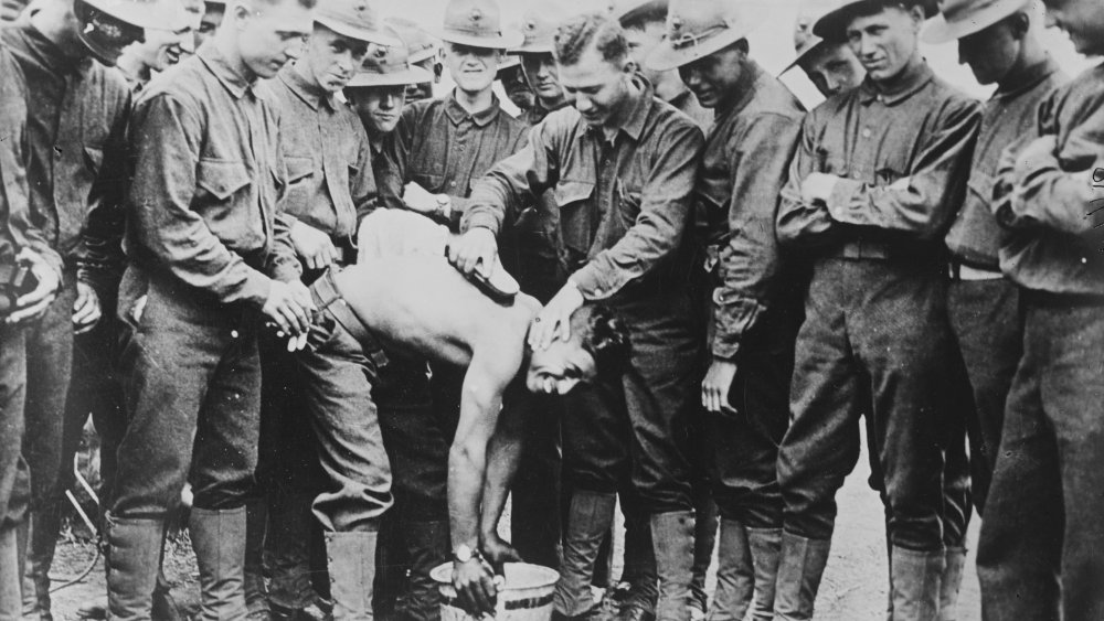 Marine Corps members routing the "Cooties", between 1915 and 1920