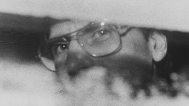 Dennis Nilsen sitting at the back of the police van