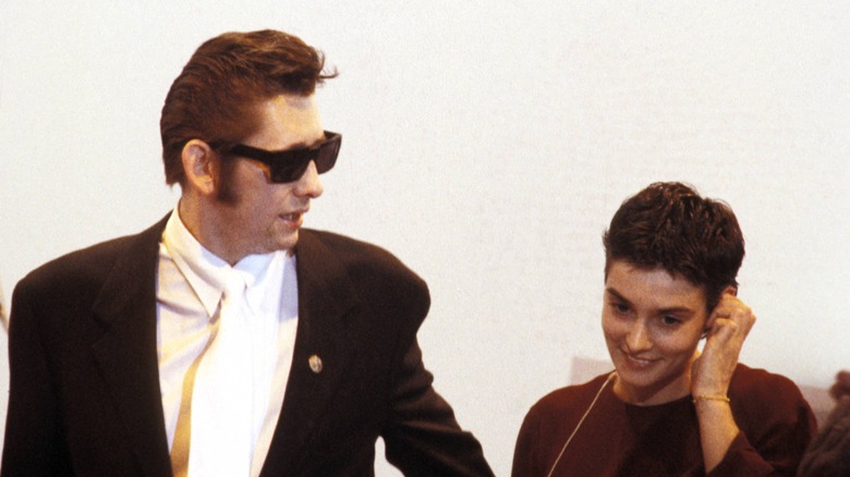 Shane MacGowan walks with Sinead O'Connor