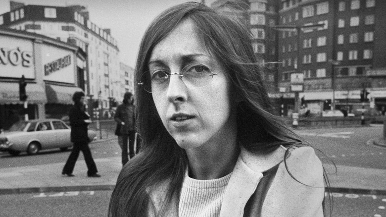 Judee Sill posing on the streets of London