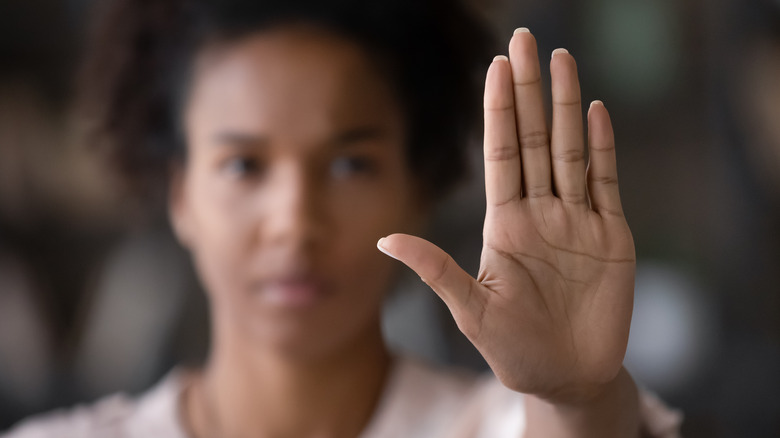 woman hand up