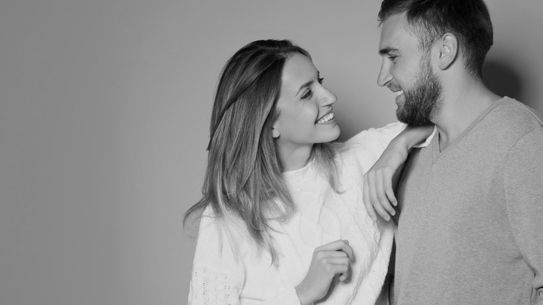 man and woman smiling