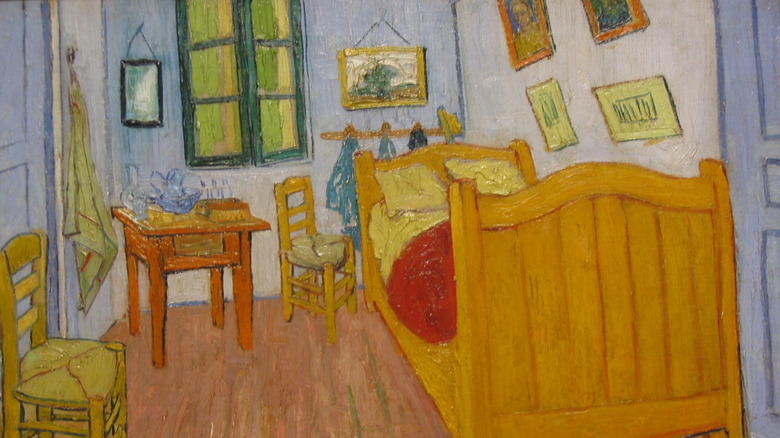 The Bedroom blue walls bed on the right