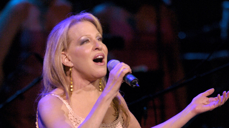 singer Bette Midler performing on stage