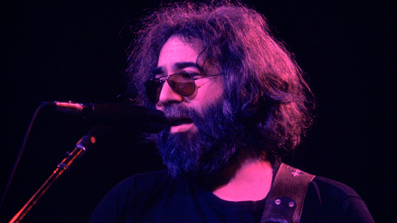 Jerry Garcia of the Grateful Dead performing on stage.