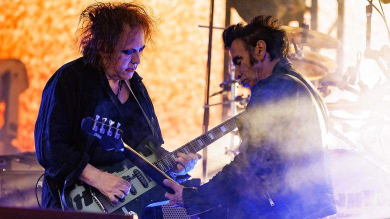 The Cure performing on stage.