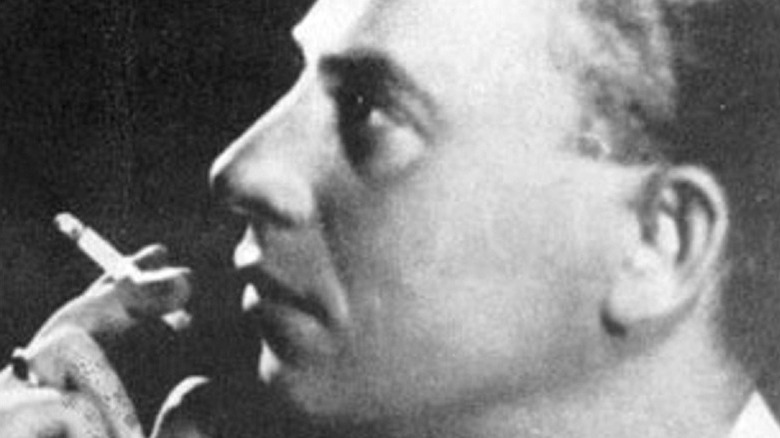 Closeup of Rezso Seress smoking looking to side