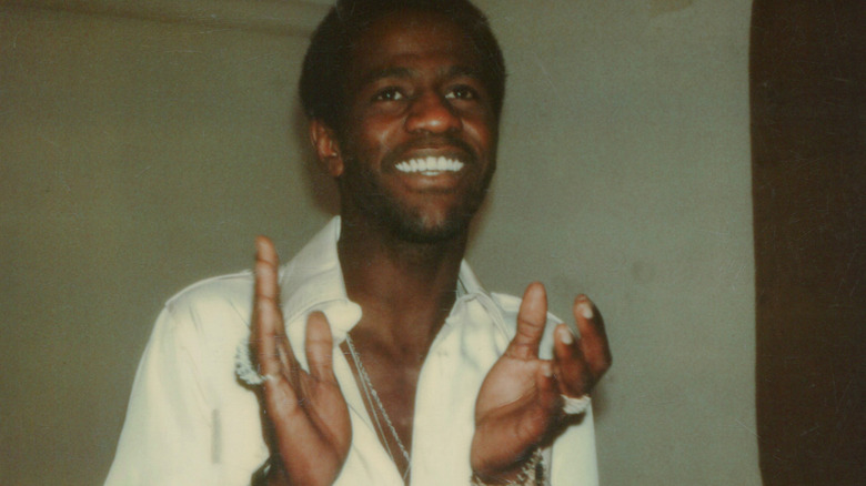 Al Green smiling and clapping