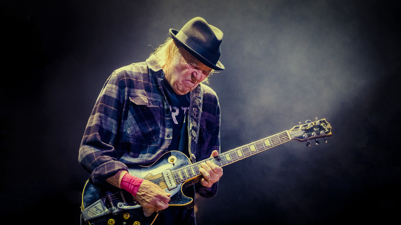 Neil Young playing guitar