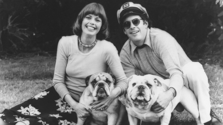 Captain and Tennille posing with dogs