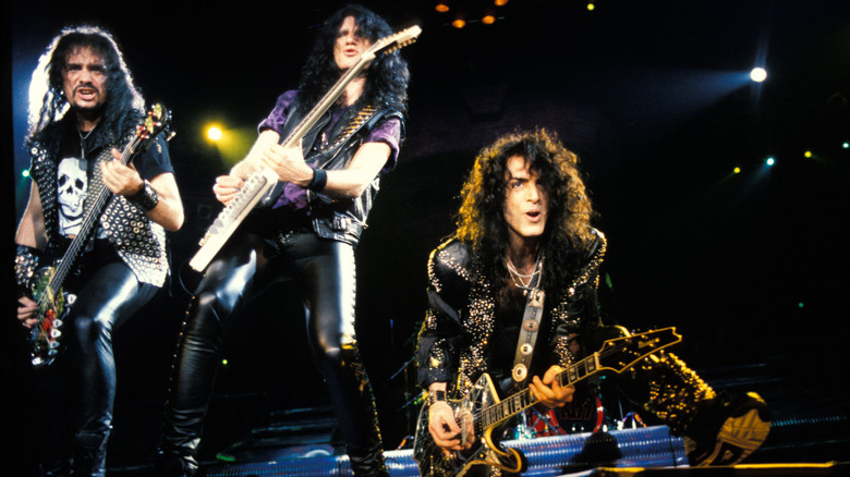 Bruce Kulick Gene Simmons and Paul Stanley rocking onstage in 1990s