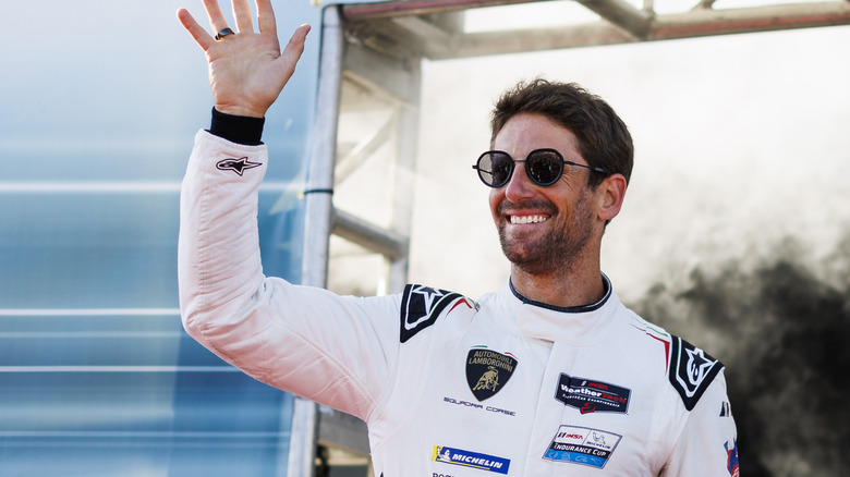 Romain Grosjean smiling and waving in 2024
