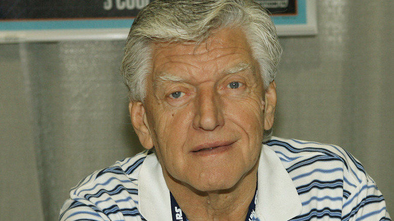 david prowse sat grey hair striped shirt