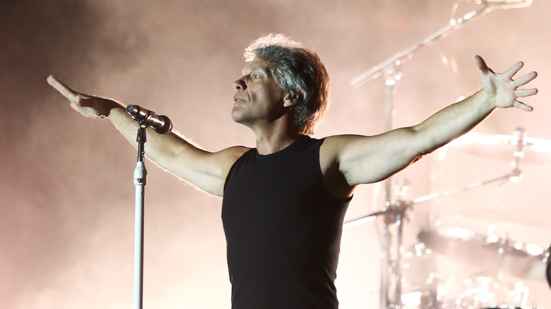 Jon Bon Jovi stage arms aloft