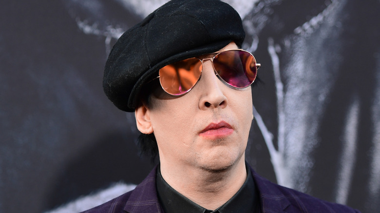 marilyn manson beret tinted glasses