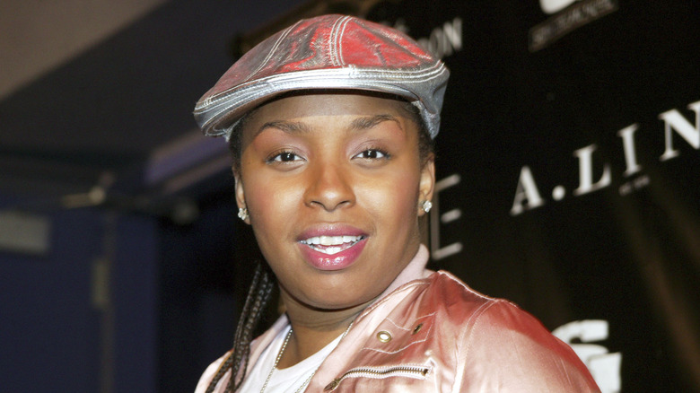 Jaguar Wright smiling while posing at an event