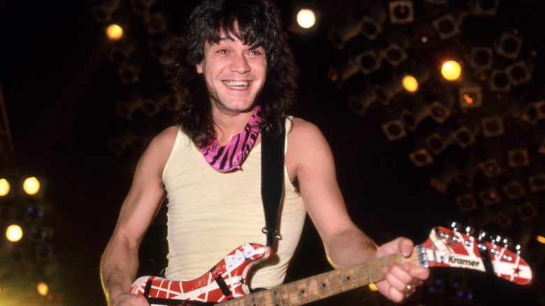 eddie van halen smiling playing guitar 80s