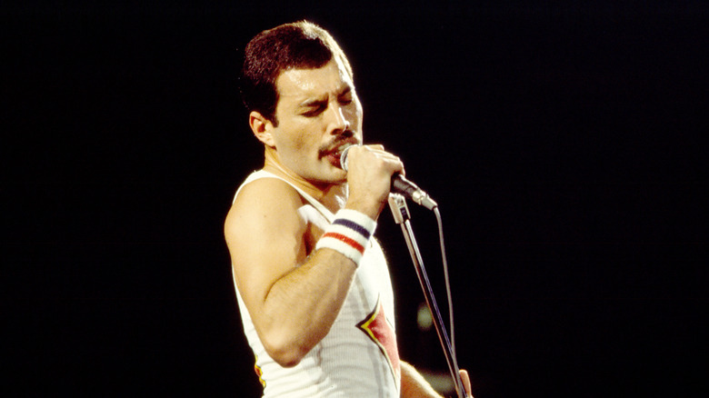 Freddie Mercury on stage shirtless