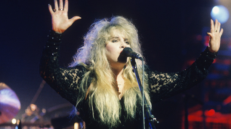 Stevie Nicks arms raised during 1990 performance