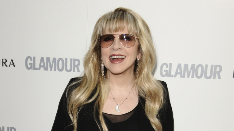 Stevie Nicks grinning in sunglasses