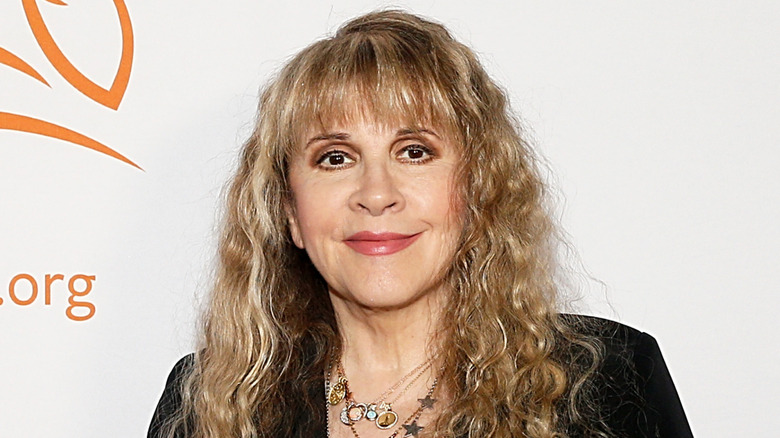 Stevie Nicks smiling mouth closed