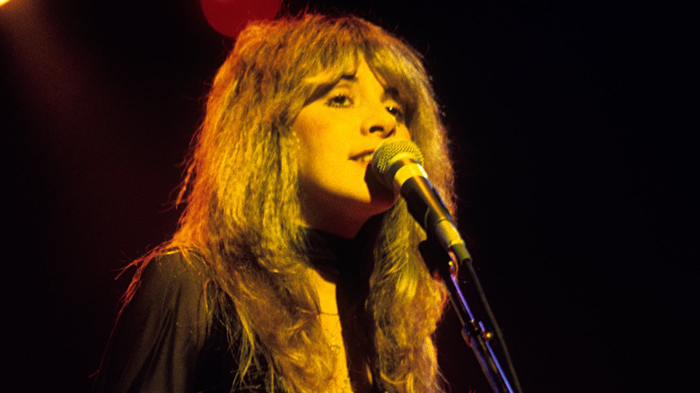 Stevie Nicks singing on stage in the late 1970s