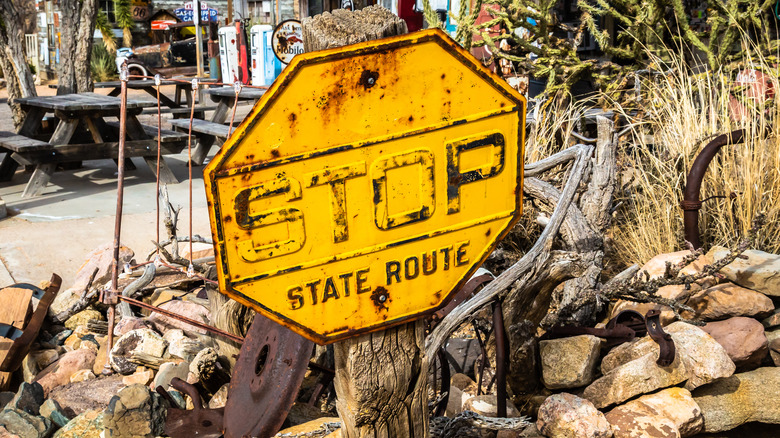 Yellow strop sign on pole
