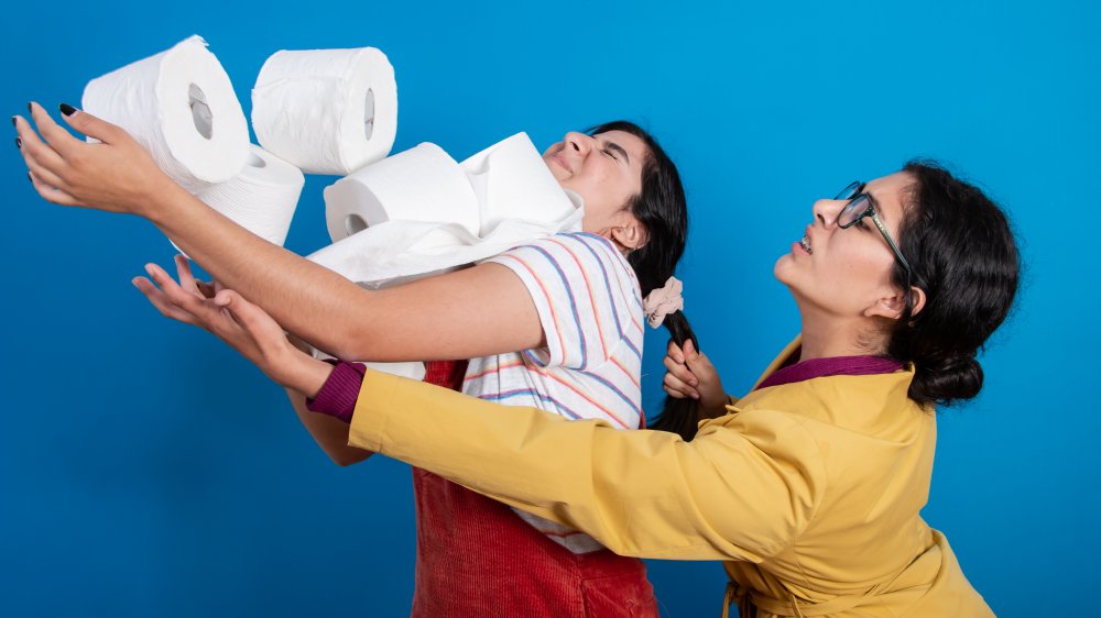 women fighting over toilet paper