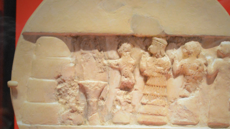 Ancient stone disk showing Enheduanna conducting religious worship