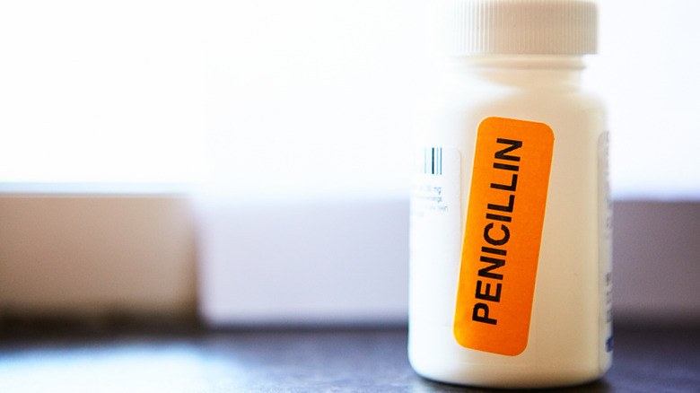 White pill bottle with "penicllin" orange label