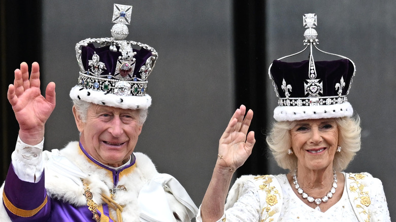 Charles III and Camilla crowns robes waving