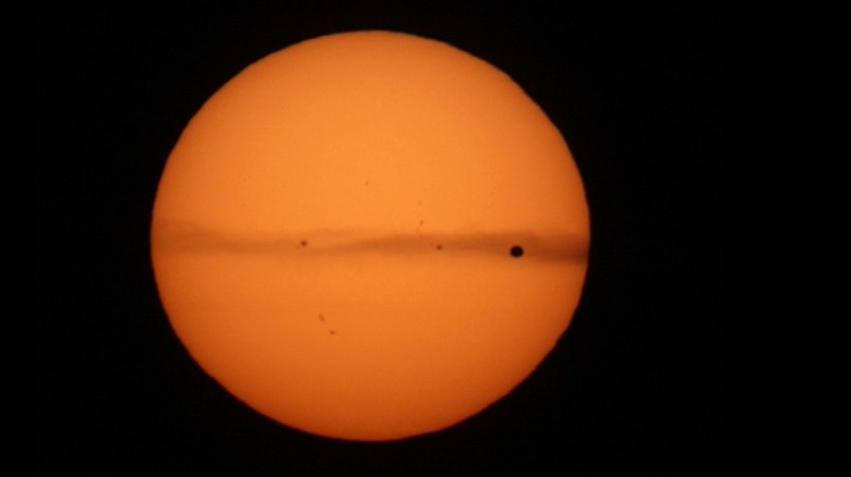 Planet Venus transiting sun