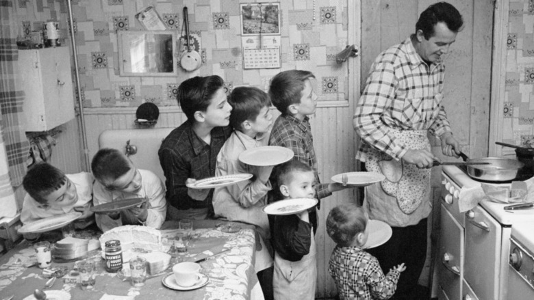 Children queuing for food in kitchen