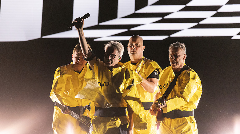 Devo performing in yellow suits