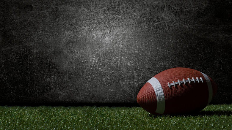 football on grass plain background