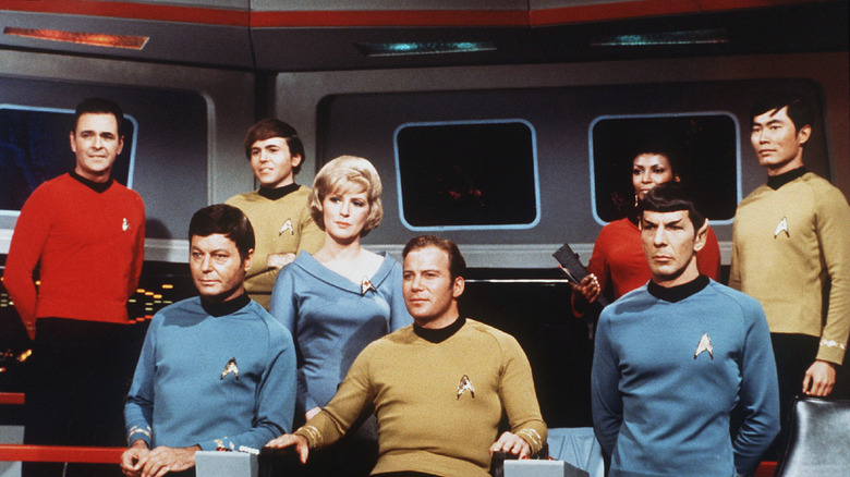 the core original star trek crew on the bridge of the enterprise