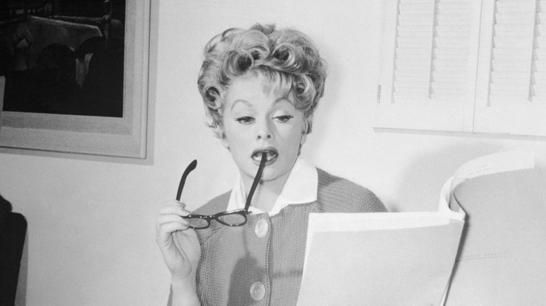 lucille ball reads a script with critical expression