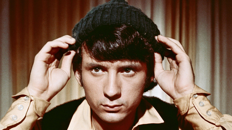 Michael Nesmith adjusting his hat
