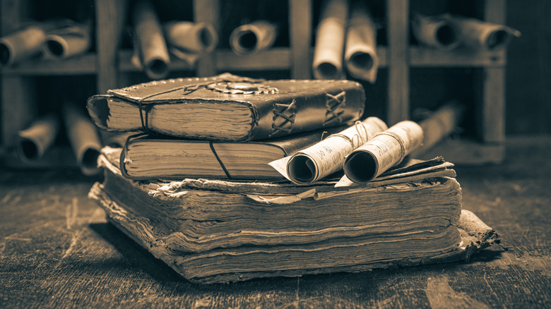 stack of medieval manuscripts and scrolls