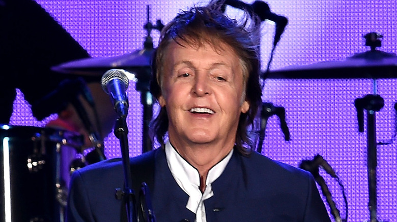 Paul McCartney smiling onstage