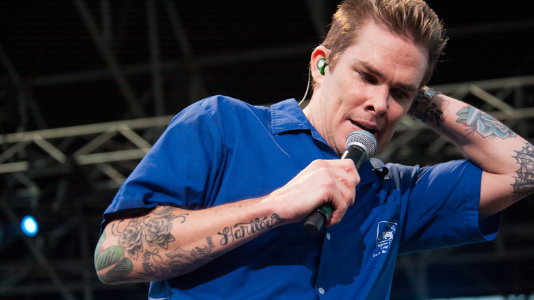 Mark McGrath performing on stage