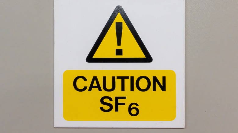 A warning sign on a wall indicating sulfur hexafluoride use