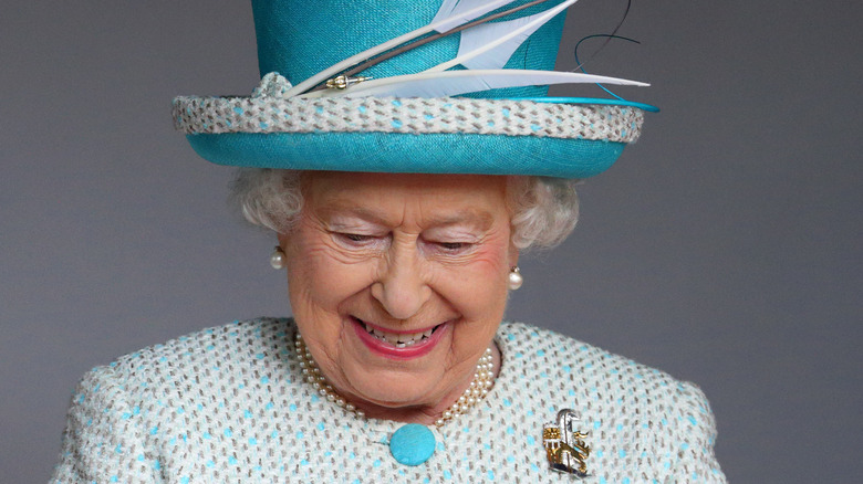 Elizabeth II wears the badge of the Duchy of Lancaster as she receives the keys to the city at Lancaster Castle