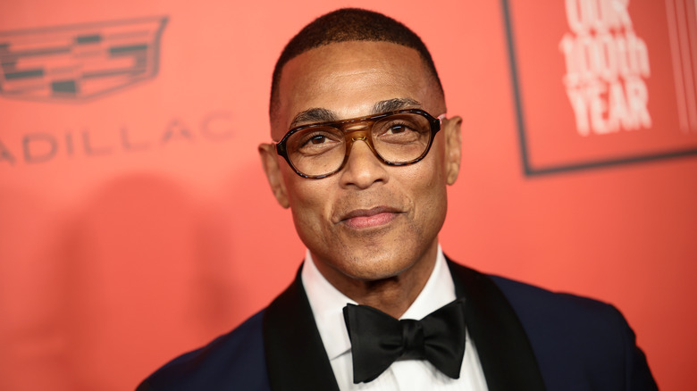 Don Lemon in suit and glasses
