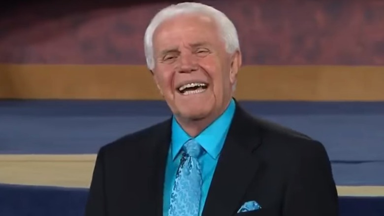 jesse duplantis smiling in blue shirt and black jacket