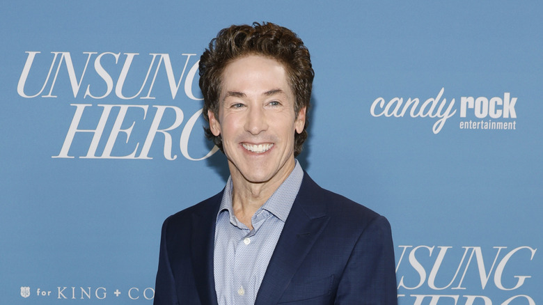 Joel Osteen smiling and looking off