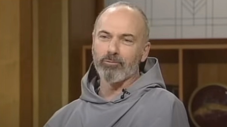 John Corapi wearing gray robes