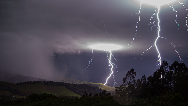 A lightning storm over hills