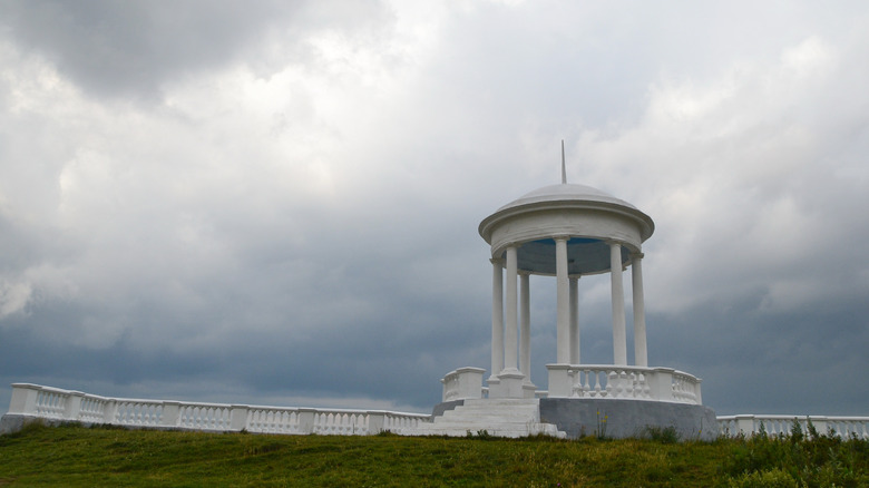 Gazebo surrounded by stormy skies
